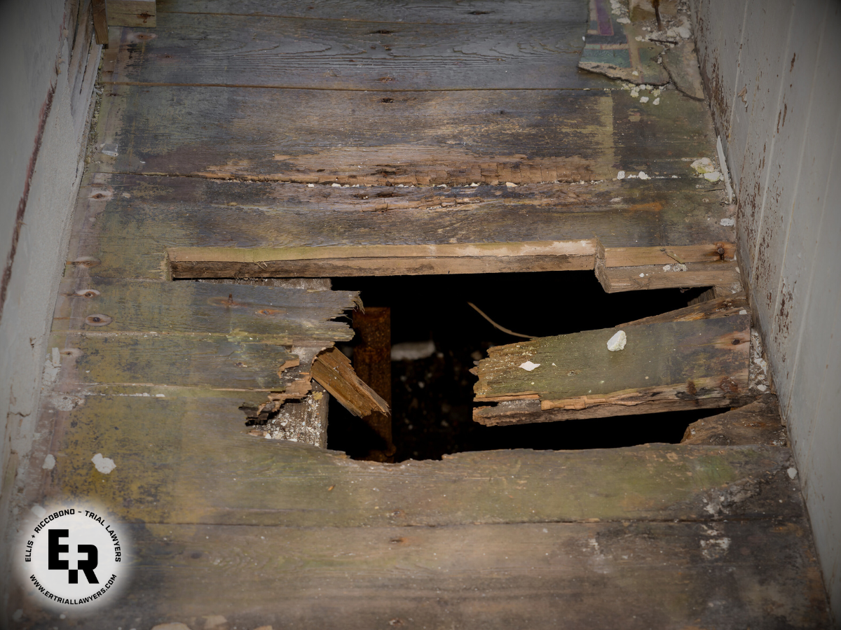 Broken wooden floor boards- premises liability